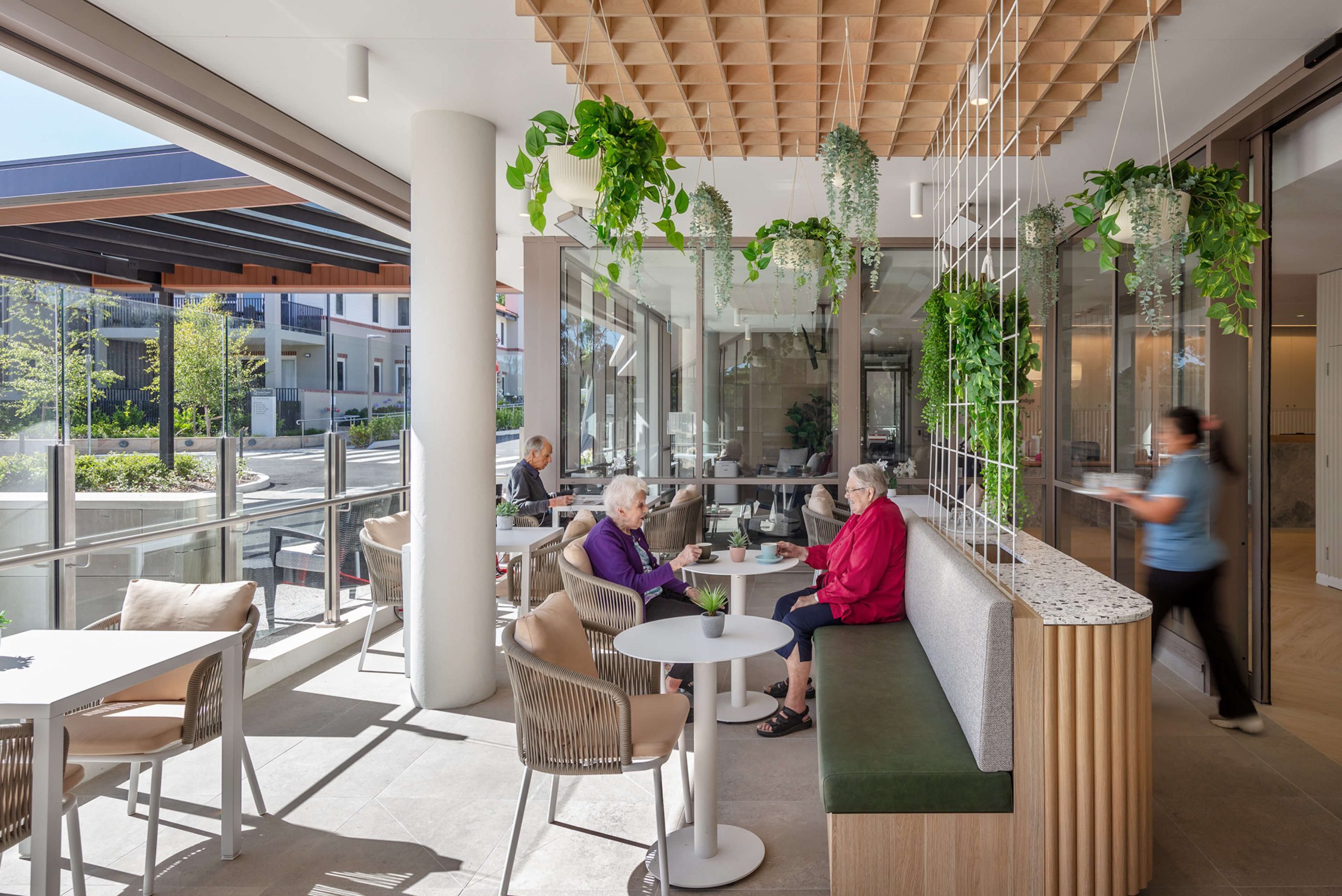 001 gordon quarter residents enjoying lunch on sunlit balcony taylor