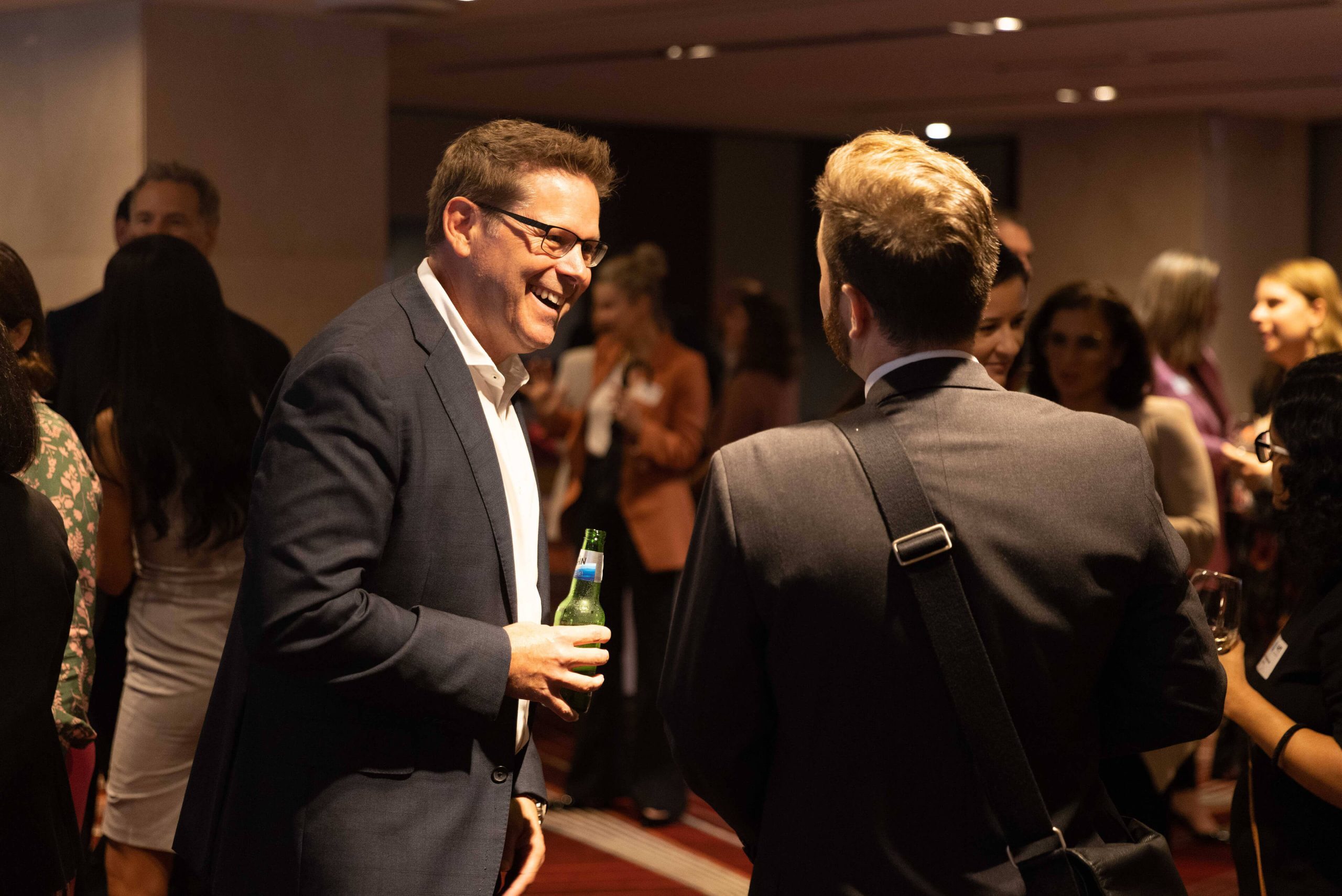 002 adam towner laughing with industry peers at 500 women in construction
