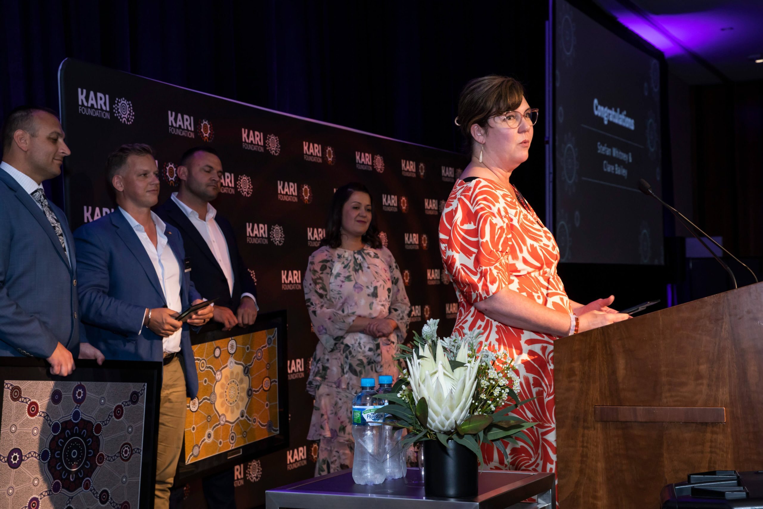 002 clare bailey accepting champion of change award kari foundation thank you awards 2022 winner 2