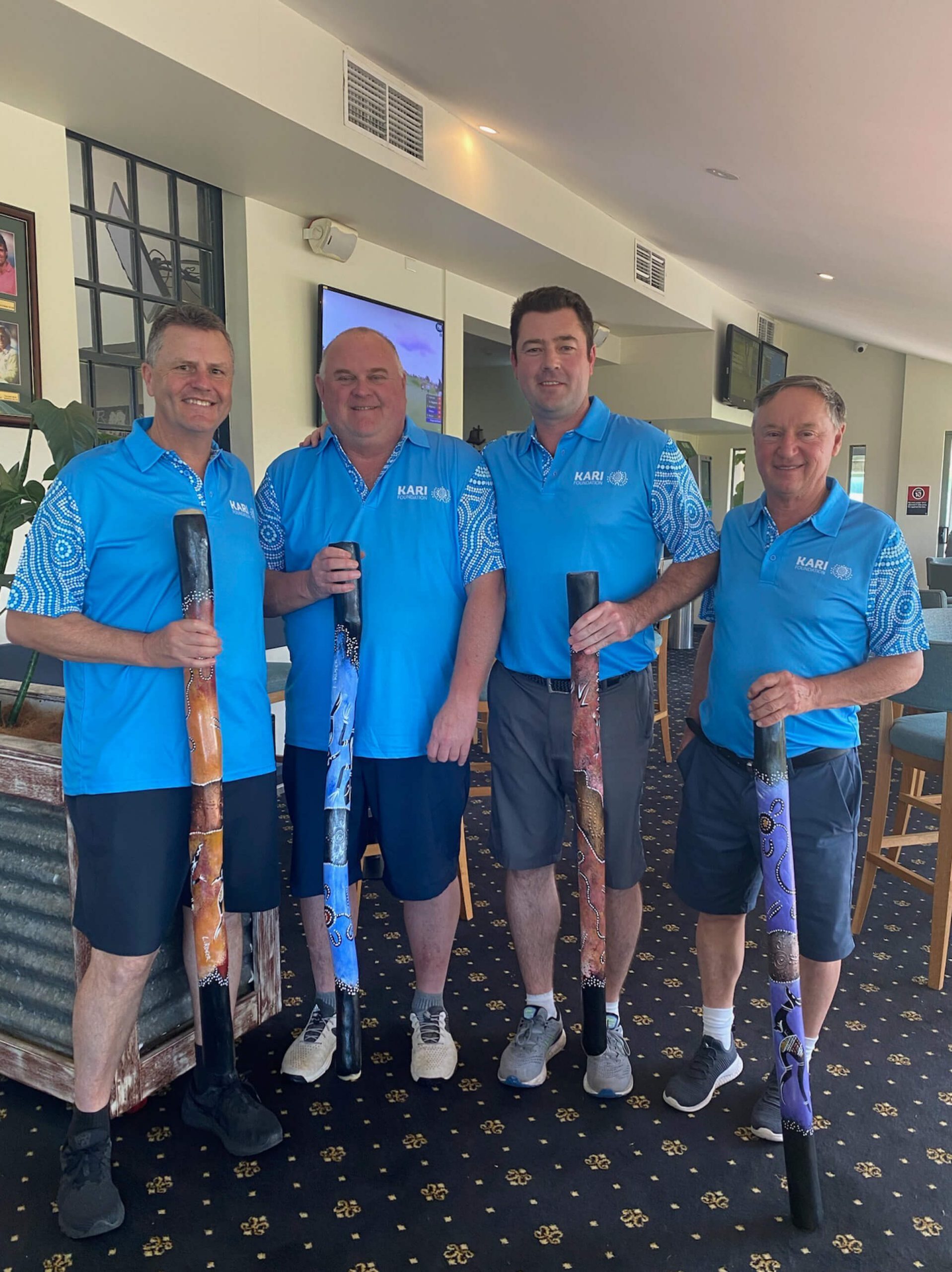 002 team taylor smiling inside at kari corporate golf day