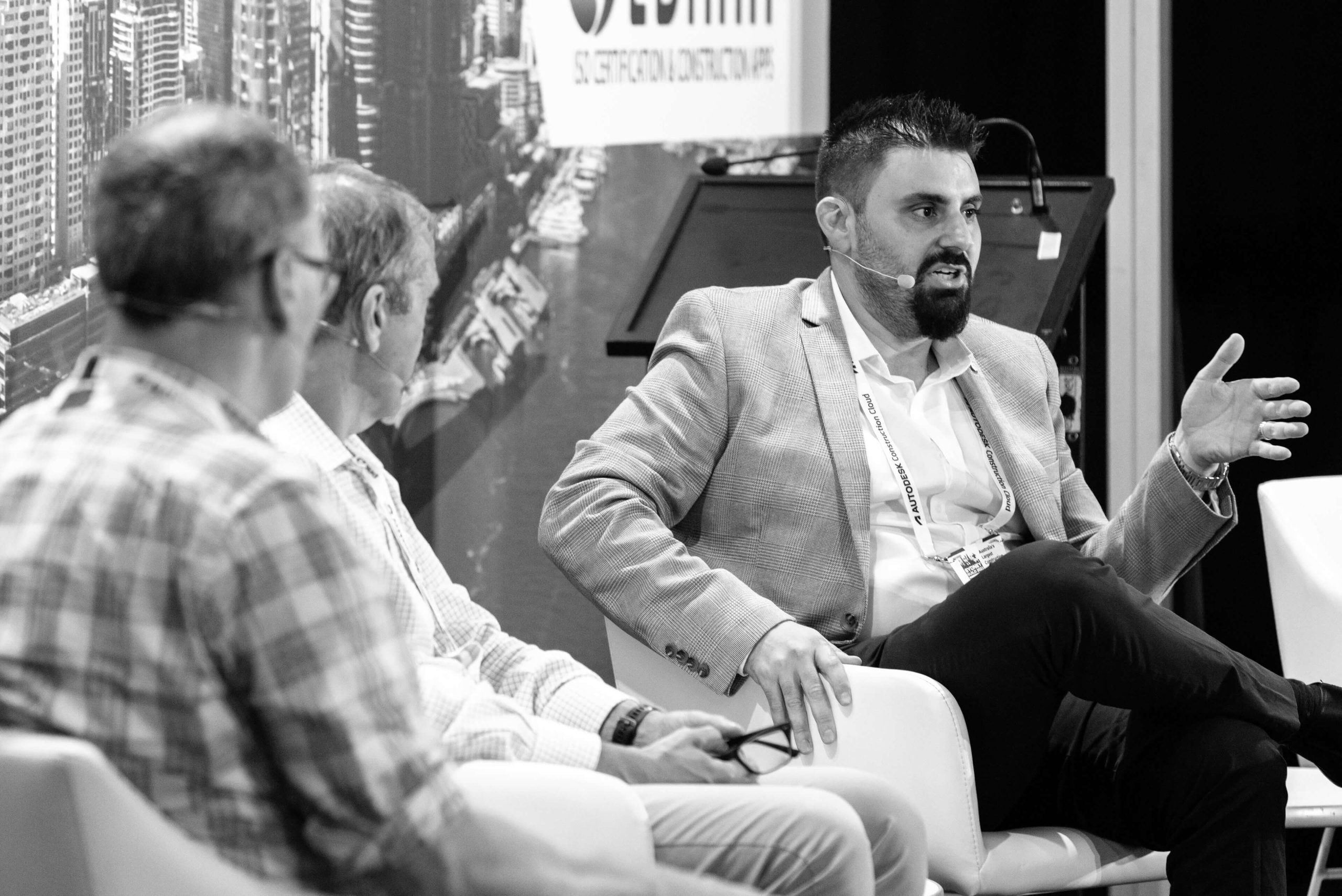 005 adam vassallo speaking with panellists black and white taylor sydney build expo 2023