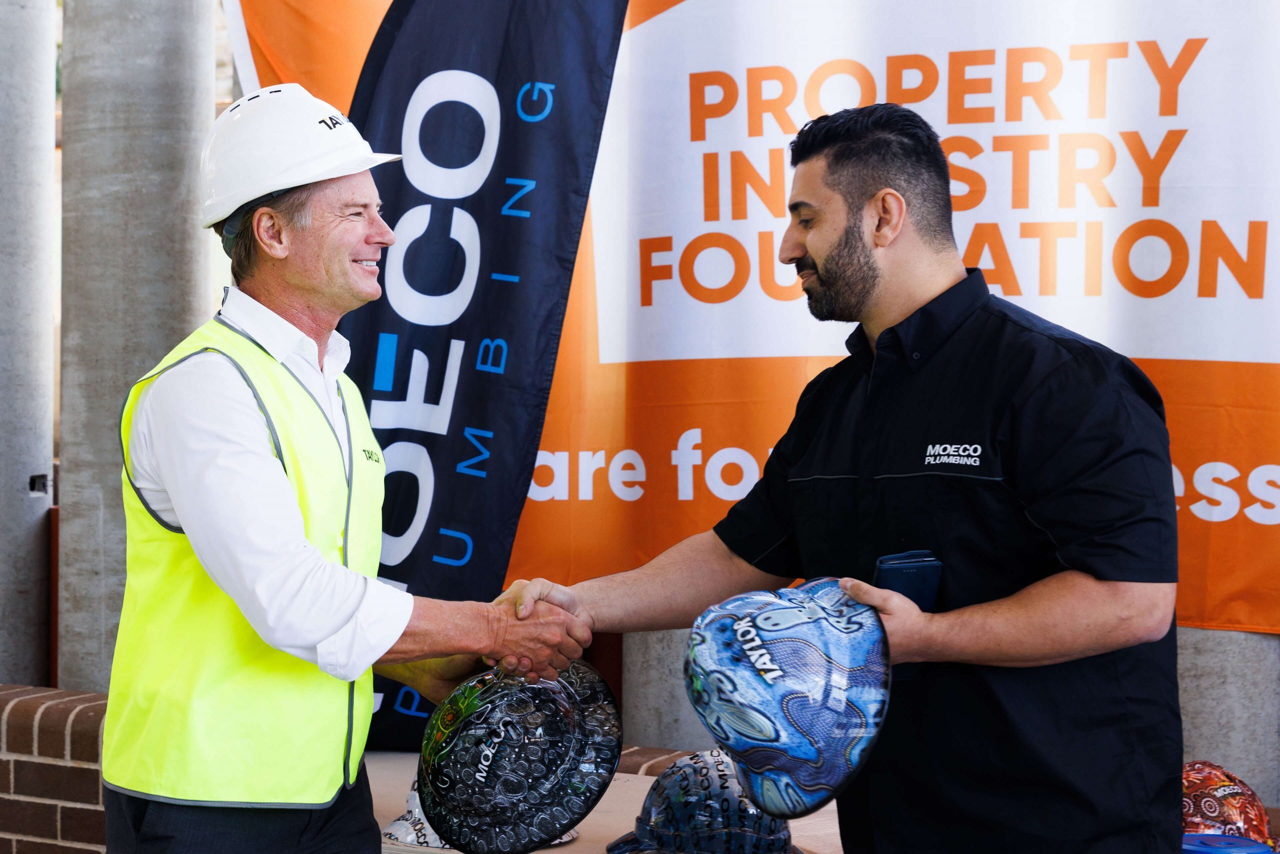 009 mark taylor joins zach from moeco plumbing at taylor hard hat day 2022