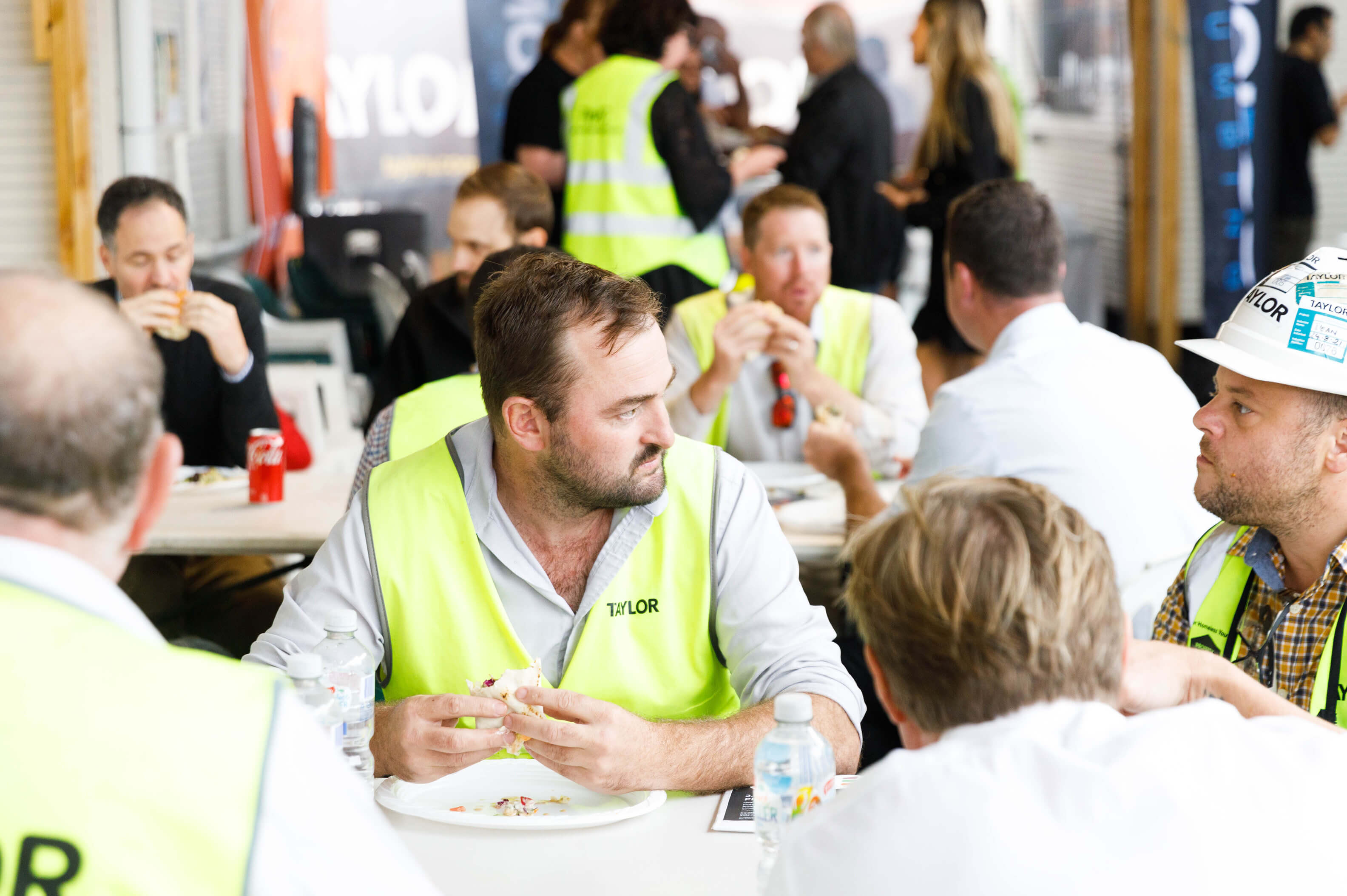 06 team taylor sitting down to eat the bbq goods taylor news article property industry foundation hard hat day