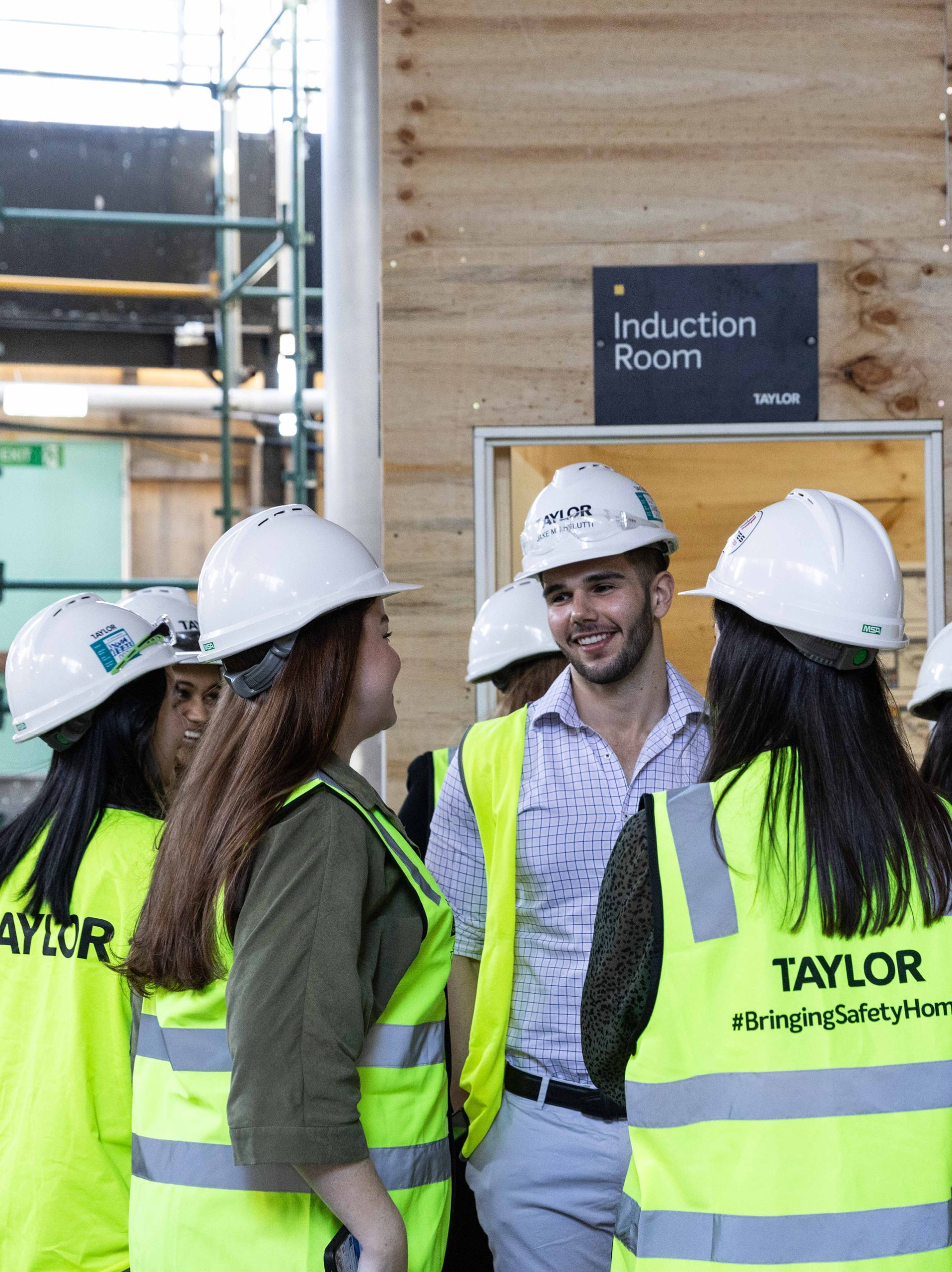 3 men and women talking twic tea and tour at scape kingsford taylor construction diversity